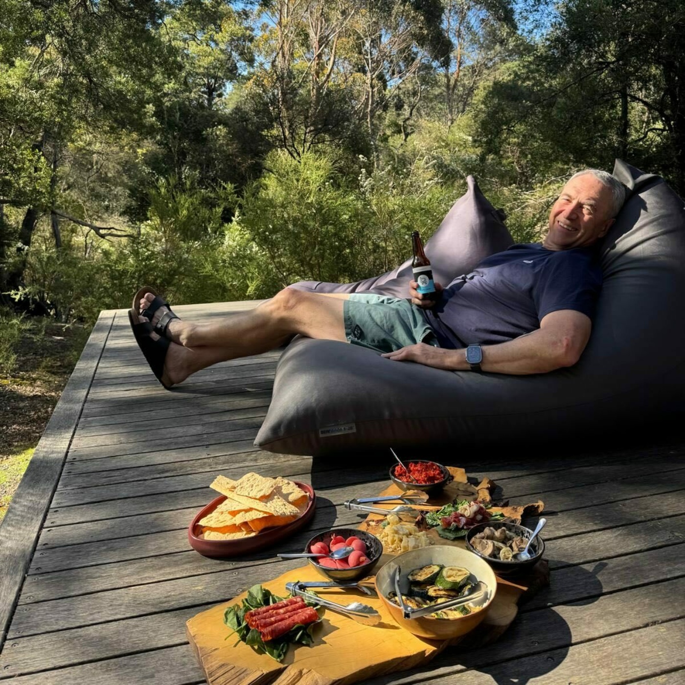 Mark relaxing on our deck after a day of riding.